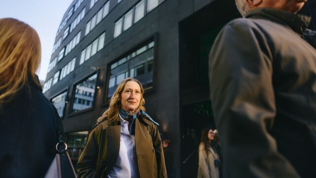 Business-woman-walking-down-street_SMALL